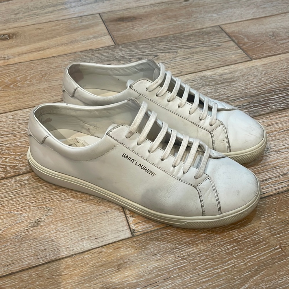 Women’s Saint Laurent white sneakers size 9. Some marks on them and dirty laces